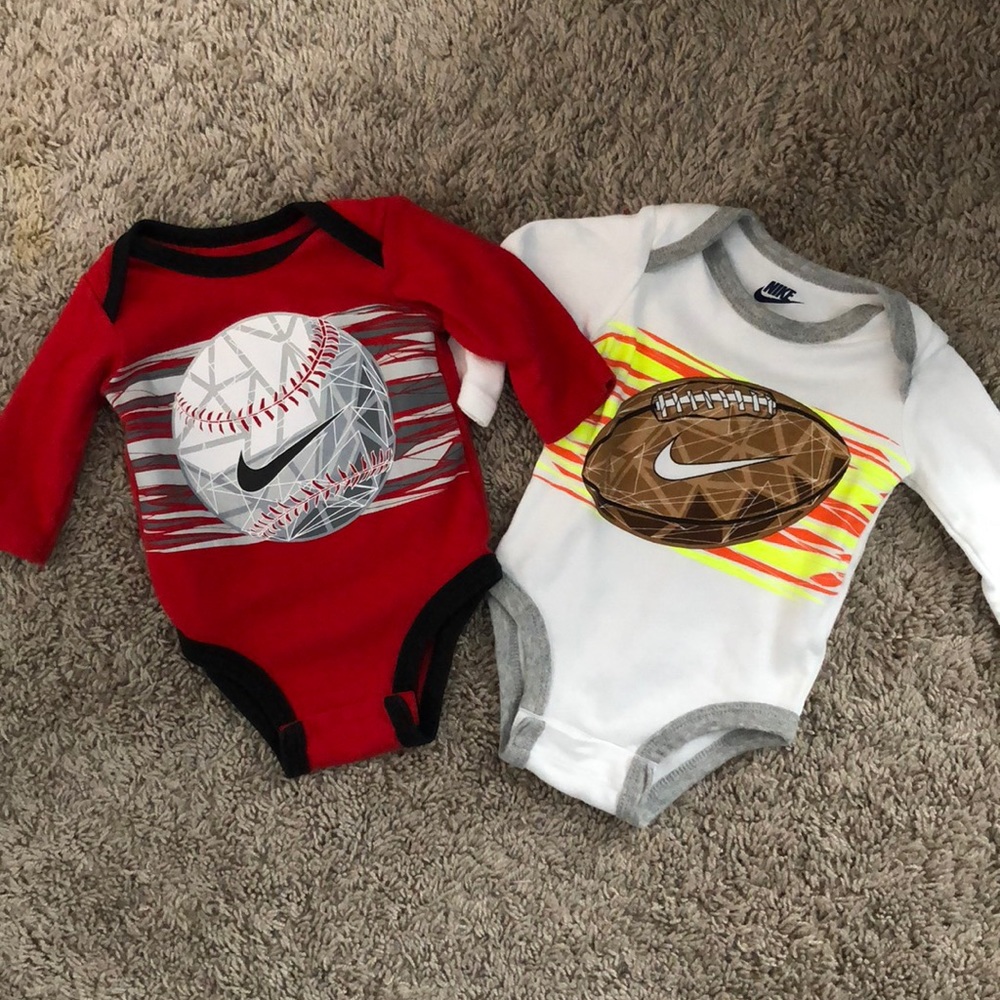 2 long sleeve Nike onesies